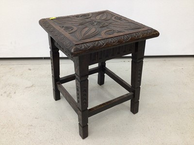 Lot 167 - Antique carved oak side table together with a similar stool (2)