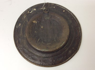 Lot 443 - 17th century German brass alms dish, with Adam and Eve embossed convex roundel and broad geometric border, 35cm diameter 
Provenance: Estate of the Late Jane Sumner