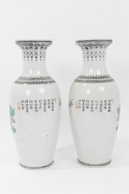 Lot 103 - Pair of Chinese Republic period vases with peacock, flowers and rock. 30.5cm high