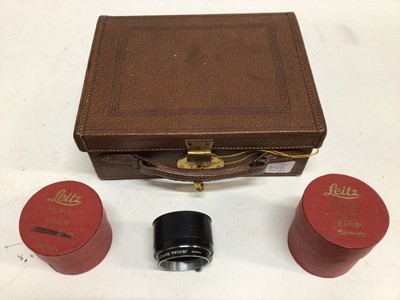 Lot 254 - Leica accessories and other items including English made leather outfit case, two red card lens boxes, two Leitz film copiers, two hoods and related literature