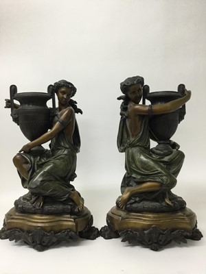 Lot 384 - Carrier-Belleuse (1824-1877) - Impressive pair of bronze and patinated bronze figural urns, each modelled as a Classical maiden cradling an Etruscan style vase raised on stepped shaped plinth with...