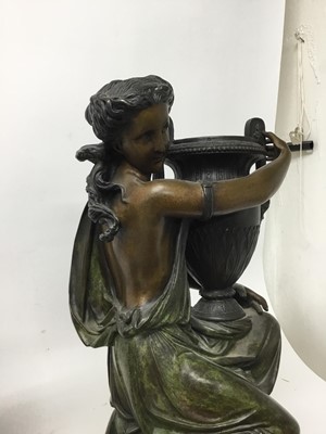 Lot 384 - Carrier-Belleuse (1824-1877) - Impressive pair of bronze and patinated bronze figural urns, each modelled as a Classical maiden cradling an Etruscan style vase raised on stepped shaped plinth with...