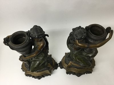 Lot 384 - Carrier-Belleuse (1824-1877) - Impressive pair of bronze and patinated bronze figural urns, each modelled as a Classical maiden cradling an Etruscan style vase raised on stepped shaped plinth with...