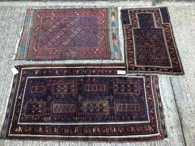 Lot 1022 - Bokhara style prayer rug, together with two further Bokhara style rugs