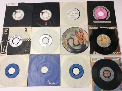 Lot 1047 - Approximately 115 min all juke box singles, almost entirely unplayed and some with title strips still intact. Artists include U2 (15 J 328, 15 319J), The Droogs, Selector, Damned, Cure, XTC, Police...