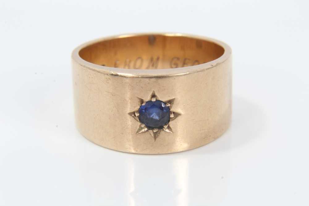 Lot 347 - 9ct gold ring with blue stone in star shape gypsy setting