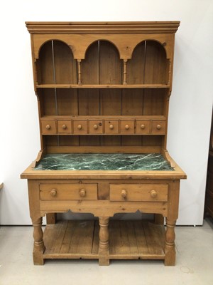 Lot 188 - Victorian style pine two-height dresser, the plate rack with  arcaded frieze, 8 spice drawers, the base with green marble top, two drawers and pot board below with turned supports. 135cm wide x 208...
