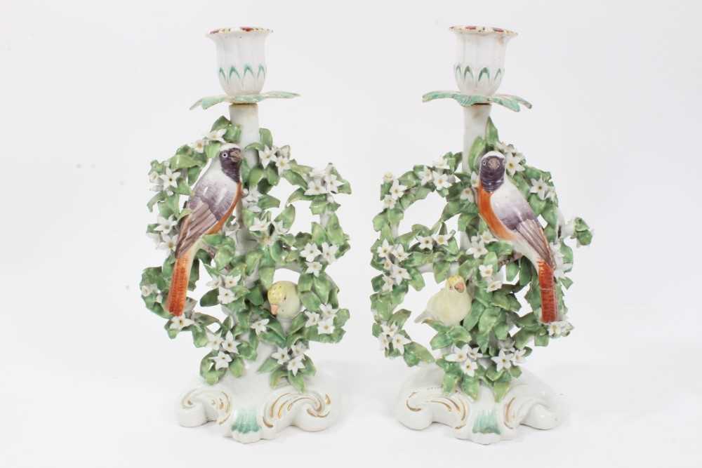 Lot 36 - Pair of Derby 'Birds in Branches' candlesticks, c.1770