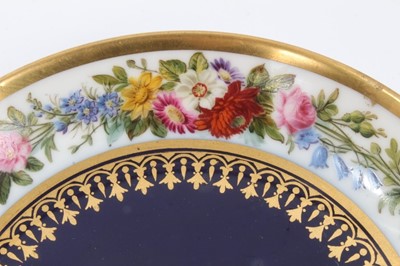 Lot 44 - Sevres dish, finely painted with flowers around the edge, the centre with gilt patterns on a bleu lapis ground, printed and inscribed marks to base, 15.25cm diameter