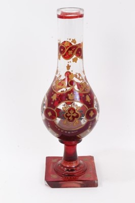 Lot 47 - Bohemian glass hookah base, decorated with gilt foliate patterns on a red ground, 29.5cm height