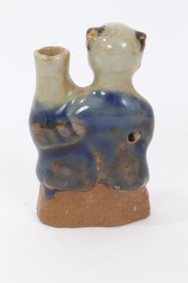 Lot 48 - Chinese Qing biscuit porcelain water dropper, in the form of a boy holding a vase, the bottom unglazed and the top glazed in two tones of blue, 7.5cm height