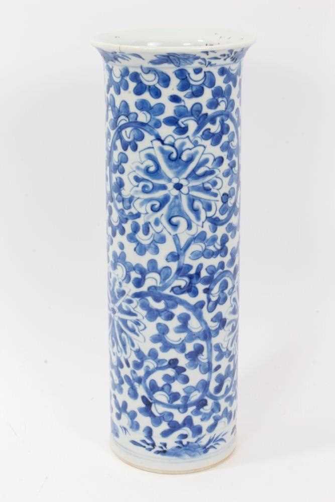 Lot 51 - Chinese blue and white porcelain sleeve vase, c.1900, painted with a scrolling foliate pattern, four-character mark to base, 31cm height