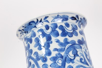 Lot 51 - Chinese blue and white porcelain sleeve vase, c.1900, painted with a scrolling foliate pattern, four-character mark to base, 31cm height