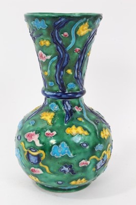 Lot 56 - Unusual 19th/20th century Japanese earthenware vase, decorated with a phoenix flying amongst stylised clouds and auspicious symbols, 15.5cm height