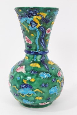 Lot 56 - Unusual 19th/20th century Japanese earthenware vase, decorated with a phoenix flying amongst stylised clouds and auspicious symbols, 15.5cm height