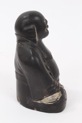 Lot 60 - Chinese earthenware figure of Buddha, painted black with silver highlights, marked to the base, 9cm height