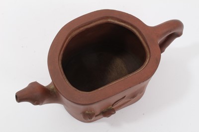 Lot 63 - Chinese Yixing teapot, fruit decoration with branch form handle and spout, seal mark to base, unusual carved wood replacement lid, 18cm length