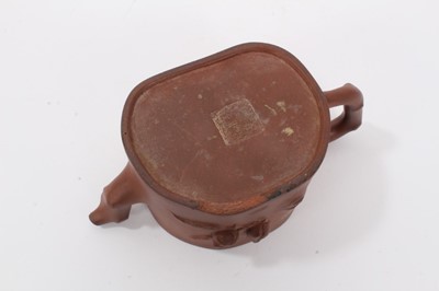 Lot 63 - Chinese Yixing teapot, fruit decoration with branch form handle and spout, seal mark to base, unusual carved wood replacement lid, 18cm length