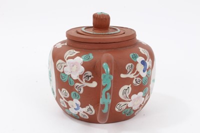 Lot 66 - Chinese Yixing teapot and strainer, enamelled with two roundels containing flowers and foliage, with further floral motifs