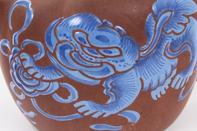Lot 67 - Chinese Yixing teapot and strainer, enamelled in blue with a foo dog, and auspicious symbols verso, seal mark to base, 12cm height x 20cm length