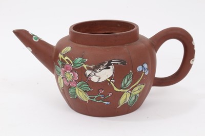 Lot 69 - Three Chinese Yixing teapots, including one enamelled with birds and flowers, another of plain melon form, and another with calligraphy, all with seal marks, between 19cm and 23cm length
