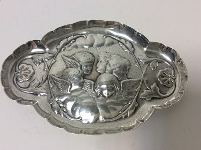 Lot 158 - Victorian silver pin dish with embossed decoration depicting Reynolds Angels (London 1897), maker William Comyns together with a Victorian style silver nurses buckle (Birmingham 1973), silver compa...