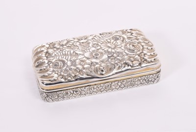 Lot 367 - Early 20th silver dressing table box of rectangular form with ornate repoussé floral decoration, domed hinged cover with gilded interior, maker Tiffany & Co, Sterling silver