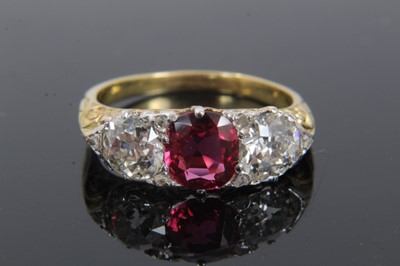 Lot 268 - Victorian style diamond and ruby three stone ring with a central oval mixed cut ruby weighing approximately 1.12cts flanked by two old cut diamonds estimated to weigh approximately 1.66cts in total...