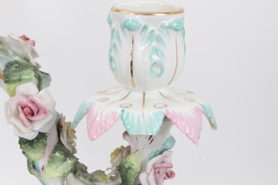 Lot 79 - Pair of Dresden figural porcelain candelabra, with three branch section fitting on to a central column, with floral encrusted decoration, marks to bases, total height 47cm