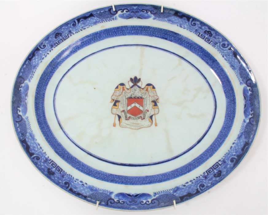 Lot 83 - Late 18th century Chinese export armorial porcelain platter, with central enamelled armorial and underglaze blue pattern to border, 40cm across