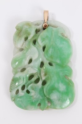 Lot 323 - Chinese carved green jade pendant with carved and pierced bird and foliage, approximately 45.8mm x 32.8mm x 7.6mm, accompanied by a Gemmological Certification Services report stating the jade to be...