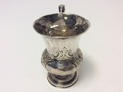 Lot 184 - Victorian silver christening mug of baluster form with chased floral and scroll decoration and loop handle, (Birmingham 1854), maker George Unite, at approximately 4oz, 9.5cm in height
