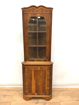 Lot 170 - Walnut finished two-height corner cabinet and a similar bookcase
