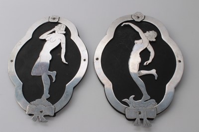 Lot 629 - Pair of Second World War Trench Art Cut aluminium plaques depicting glamour girls (2)