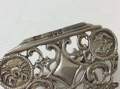 Lot 134 - Late Victorian silver heart shaped letter clip with pierced and Zodiac sign decoration, (London 1898), maker Grey & Co, 6.5cm in length