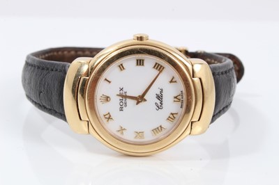 Lot 359 - Ladies Rolex Cellini 18ct gold wristwatch with circular white enamel dial with applied gold Roman numerals and gold hands in circular 18ct gold case with articulated gold lugs on Rolex black leathe...