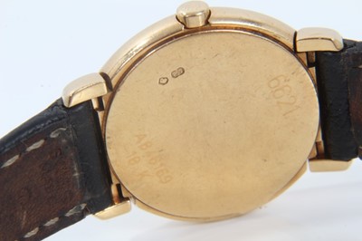 Lot 359 - Ladies Rolex Cellini 18ct gold wristwatch with circular white enamel dial with applied gold Roman numerals and gold hands in circular 18ct gold case with articulated gold lugs on Rolex black leathe...