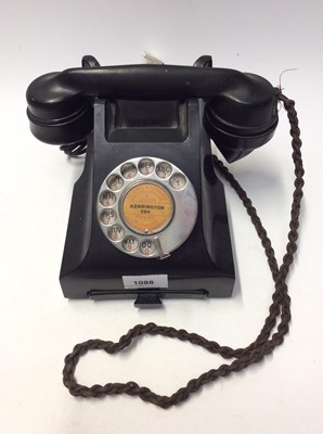 Lot 1088 - A vintage black bakelite telephone, central boss with label 'Kensington 264'