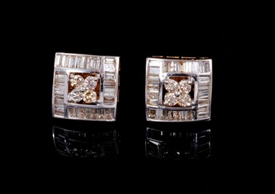 Lot 246 - Pair of diamond cluster earrings, each square with a central cluster of four round brilliant cut diamonds surrounded by a border of channel-set baguette cut diamonds in 18ct gold setting, each squa...