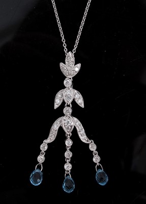 Lot 248 - Diamond and blue topaz pendant necklace with three briolette cut blue topaz drops suspended from an articulated stylised floral design with brilliant cut diamonds in grain setting, on trace chain,...