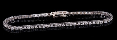 Lot 251 - Diamond tennis bracelet with a line of 61 brilliant cut diamonds in 18ct white gold setting, estimated total diamond weight approximately 2cts, length approximately 17.5cm.