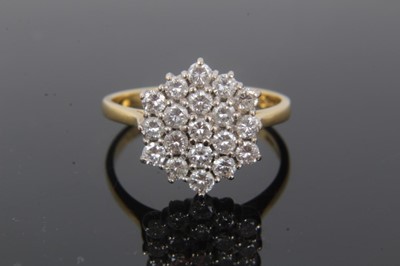 Lot 256 - Diamond cluster ring with a hexagonal cluster of round brilliant cut diamonds in tiered claw setting on 18ct yellow gold shank. Estimated total diamond weight approximately 0.75cts, ring size L.