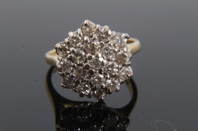 Lot 259 - Diamond cluster ring with a hexagonal cluster of 19 brilliant cut diamonds in tiered claw setting on 18ct yellow gold shank, estimated total diamond weight approximately 1ct. Hallmarked London 1975...