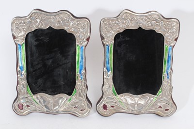 Lot 302 - Pair of Art Nouveau style white metal and enamel photograph frames