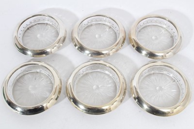 Lot 303 - Set of six American silver mounted glass coasters, stamped 'Webster's Sterling', each 10cm in diameter (6)