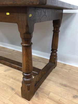 Lot 172 - Solid oak dining table on baluster turned legs joined by H-shaped stretcher