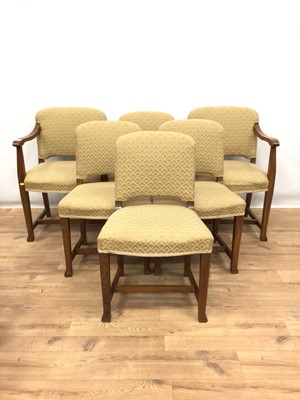 Lot 173 - Set of six oak framed dining chairs with upholstered seats and backs comprising four standards and a pair of carvers