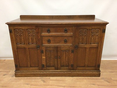 Lot 174 - Carved oak sideboard with two drawers and cupboards, 141cm wide, 55cm deep and 95cm high
