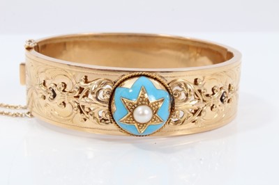Lot 274 - Late 19th century French gold, pearl and turquoise enamel hinged bangle with central domed plaque
