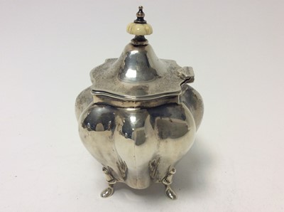 Lot 189 - Edwardian silver tea caddy of bombe form, domed hinged cover with ivory finial, raised on four hoof feet, approximately 8oz, 13cm in height